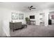 Cozy loft area with comfortable seating, a ceiling fan, and access to other rooms in the house at 624 Bellus Pl # Lot 170, Henderson, NV 89015