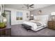 Serene primary bedroom with a king-size bed, neutral tones, and scenic outdoor views at 624 Bellus Pl # Lot 170, Henderson, NV 89015