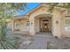 Welcoming front exterior with brick walkway and covered porch with classic design at 6325 Guy Ave Ave, Las Vegas, NV 89131