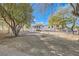 Spacious property featuring mature trees, and a horse trailer at 6325 Guy Ave Ave, Las Vegas, NV 89131