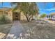 Charming front exterior featuring lush landscaping, a brick walkway and a horse trailer at 6325 Guy Ave Ave, Las Vegas, NV 89131
