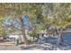 Single-story home with a gray exterior and landscaping, offering comfortable living at 6325 Guy Ave Ave, Las Vegas, NV 89131
