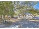 Expansive front yard featuring mature trees, and a well manicured lawn at 6325 Guy Ave Ave, Las Vegas, NV 89131