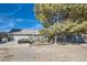 Home featuring a spacious garage and a large driveway at 6325 Guy Ave Ave, Las Vegas, NV 89131