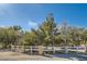 Street view of property entrance with a classic white fence and address marker at 6325 Guy Ave Ave, Las Vegas, NV 89131