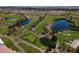 Aerial view of the golf course with serene ponds and lush greenery at 652 Del Prado Dr, Boulder City, NV 89005