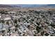 Aerial view of the community with mountains and lake in the distance at 652 Del Prado Dr, Boulder City, NV 89005