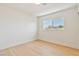 Bright bedroom with a window letting in lots of natural light and light wood flooring at 652 Del Prado Dr, Boulder City, NV 89005