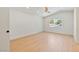 Bright, minimalist bedroom with vaulted ceiling, hardwood floors, and natural light from the window at 652 Del Prado Dr, Boulder City, NV 89005
