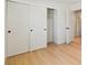 Bedroom closet with sliding doors and a light wood floor at 652 Del Prado Dr, Boulder City, NV 89005