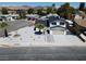 Aerial view of a charming home with a well-manicured yard and an attached two-car garage at 652 Del Prado Dr, Boulder City, NV 89005