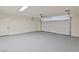 Spacious two car garage with painted floor and garage door at 652 Del Prado Dr, Boulder City, NV 89005