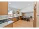 Modern kitchen featuring a breakfast bar, bright lighting, and new stainless steel appliances at 652 Del Prado Dr, Boulder City, NV 89005