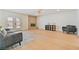 Spacious living room with hardwood floors, a brick fireplace, and large windows at 652 Del Prado Dr, Boulder City, NV 89005