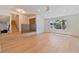 Bright and open living room with hardwood floors, a modern staircase, and large windows at 652 Del Prado Dr, Boulder City, NV 89005