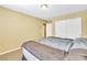Bedroom with light walls, carpet, and a double closet with sliding doors at 6558 Musette Ave, Las Vegas, NV 89139