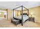 Bedroom featuring a four poster bed, two side tables and carpet flooring at 6558 Musette Ave, Las Vegas, NV 89139