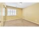 Bedroom with light walls and carpet, and a window with shutters at 6558 Musette Ave, Las Vegas, NV 89139