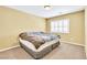This bedroom has neutral walls and carpet, and a window with shutters at 6558 Musette Ave, Las Vegas, NV 89139