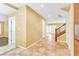 Hallway with tile flooring, neutral walls, staircase and multiple doorways at 6558 Musette Ave, Las Vegas, NV 89139
