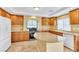 Bright kitchen with stainless steel appliances, an island and tile flooring at 6558 Musette Ave, Las Vegas, NV 89139