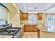 Open concept kitchen featuring granite counters and stainless steel gas range at 6558 Musette Ave, Las Vegas, NV 89139