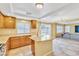 Open kitchen with stainless appliances, granite countertops and breakfast bar overlooking living area at 6558 Musette Ave, Las Vegas, NV 89139