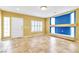 Spacious living room with tile flooring and bright light coming through the windows at 6558 Musette Ave, Las Vegas, NV 89139
