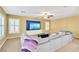 Cozy living room features ceiling fan, built in TV, and plantation shutters at 6558 Musette Ave, Las Vegas, NV 89139
