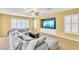 Comfortable living room offers ceiling fan, built in TV, and plantation shutters at 6558 Musette Ave, Las Vegas, NV 89139