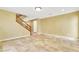 View of living room, staircase, yellow walls, and tile flooring at 6558 Musette Ave, Las Vegas, NV 89139
