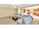Bright living room features a large sectional sofa, ceiling fan, and an open floorplan at 6558 Musette Ave, Las Vegas, NV 89139
