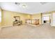 Bright open loft area with carpet flooring, a make-up vanity, and railing at 6558 Musette Ave, Las Vegas, NV 89139