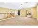 Spacious loft area with carpet flooring, a make-up vanity, and railing at 6558 Musette Ave, Las Vegas, NV 89139