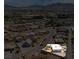 View of the home nestled in a vibrant neighborhood with convenient access to city amenities and picturesque mountain backdrop at 67 Oklahoma Dr, Henderson, NV 89015