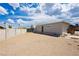 Large backyard with dirt area, block fence and access to the house at 67 Oklahoma Dr, Henderson, NV 89015