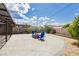 Nice backyard with brick pavers, fire pit, and Adirondack chairs surrounded by desert landscaping at 67 Oklahoma Dr, Henderson, NV 89015