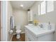 Bathroom with tiled floor, white vanity, and modern fixtures at 67 Oklahoma Dr, Henderson, NV 89015