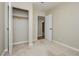 Comfortable bedroom with an open closet, neutral walls, carpet, trim, and ceiling fan at 67 Oklahoma Dr, Henderson, NV 89015