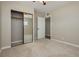 Bedroom showcasing a mirrored closet, carpet, neutral walls and a ceiling fan at 67 Oklahoma Dr, Henderson, NV 89015