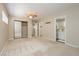 Bedroom featuring a mirrored closet, ceiling fan, and ensuite bathroom at 67 Oklahoma Dr, Henderson, NV 89015