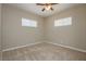 Neutral bedroom featuring carpet, a ceiling fan, and windows with blinds at 67 Oklahoma Dr, Henderson, NV 89015