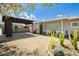 Inviting single-story home with a covered carport, gravel yard, desert landscaping, and a cozy front porch at 67 Oklahoma Dr, Henderson, NV 89015