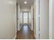 Hallway featuring wood-look tile flooring leading to a rear door at 67 Oklahoma Dr, Henderson, NV 89015