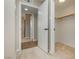 Hallway featuring wood-look tile flooring and access to multiple rooms at 67 Oklahoma Dr, Henderson, NV 89015