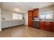 Bright kitchen featuring updated stainless steel appliances, cherry cabinets, and an expansive countertop at 67 Oklahoma Dr, Henderson, NV 89015