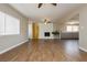Bright and open living room features a stone fireplace and updated flooring at 67 Oklahoma Dr, Henderson, NV 89015