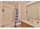 This bathroom includes a shower and tub combination with a vanity and toilet at 6739 Twisted Wood Dr, Las Vegas, NV 89148