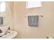 Bathroom with a modern sink, countertop, framed mirror and a hand towel at 6739 Twisted Wood Dr, Las Vegas, NV 89148