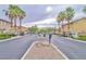 Gated entrance to the community with palm trees at 6739 Twisted Wood Dr, Las Vegas, NV 89148